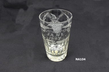 Clear glass tumbler with leaf pattern etched and 'Jane 1887' engraved