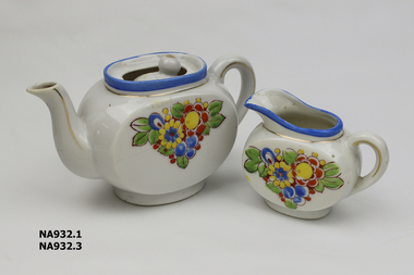 Child's china tea set - white with blue edge and flowered pattern. Comprising: tea pot with lid, milk jug with one handle, 1 cup, 1 bowl, 1 oval plate, 1 oval plate, 3 saucers, 5 plates.