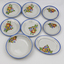 Child's china tea set - white with blue edge and flowered pattern.