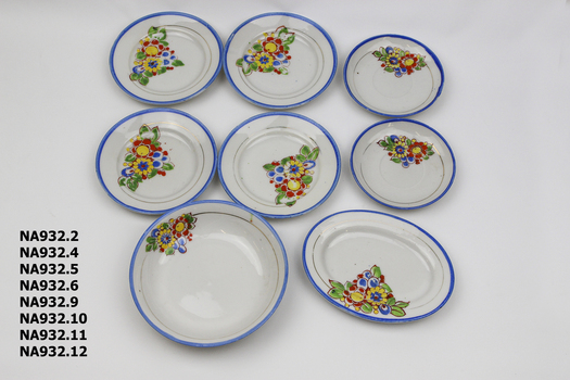 Child's china tea set - white with blue edge and flowered pattern.