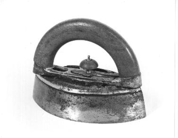 An iron pointed at both ends. A wooden handle with a clip on it so that it could be clipped to the iron heated on the stove. 