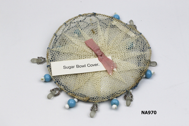 Circular net sugar bowl cover. 