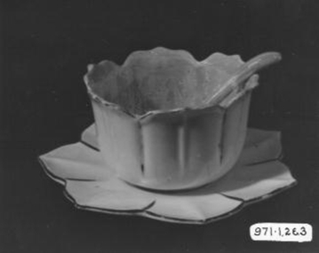  White china sauce boat, spoon and saucer with fluted edges like petals