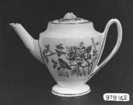 White china tea pot with red flowered decoration and gold trim