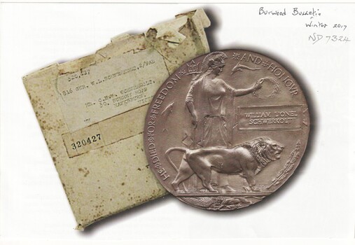 During WW1 a competition took place to design a suitable plaque to be given to the bereaved next of kin of fallen servicemen & women which resulted in the 'Dead Man's Penny'
