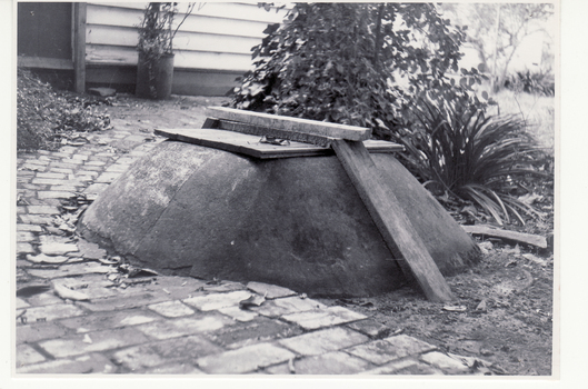 Black and white photo of well at rear of original Blackburn Post Office.