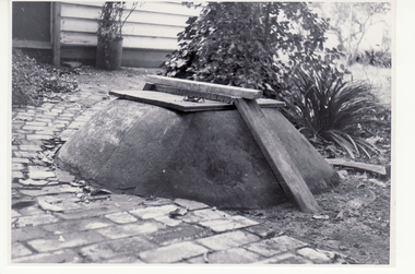 Black and white photo of well at rear of original Blackburn Post Office.