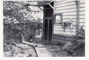 Black and white photo of Well at rear of original  post office in 1876