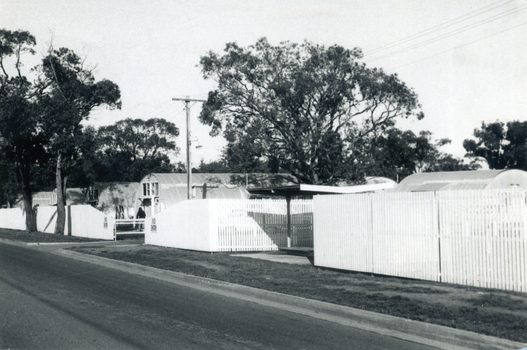 Black and white photo of Migrant Hostel, Rooks Road, Nunawading showing the old side Nissin hut accommodation.