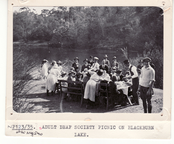 Black and white photo of Adult Deaf Society picnic on the Blackburn Lake.
