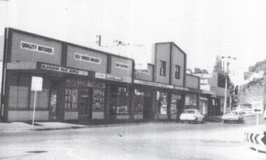 B/W strip photo of Blackburn Road Shops.