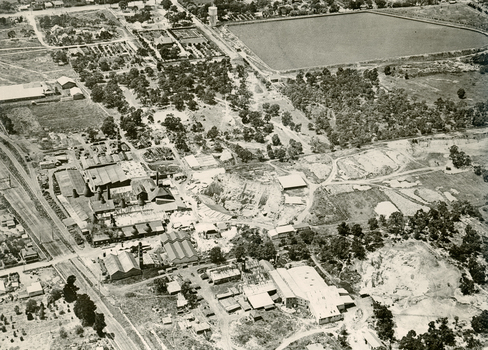 An  aerial view of Australian Tessellated Tile Works. |In the background M & MBW reservoir. In the foreground is the Builders Trading and Roofing Company Tile works (formerly the Monarch Pottery - note the M on the chimney)