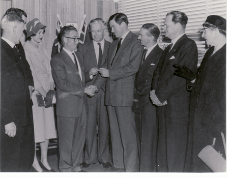 Mr. J.D. Jess, MHR handing over key of Blackburn Post Office to Mr. J.S. (Bert) Treloar, Postmaster. 