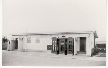 Black and white photo of temporary structure used as a Post Office during construction of present Blackburn Post Office