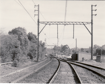 Black and white photo of Blackburn Railway Station taken from Blackburn Road Railway Crossing looking left.