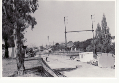 Black and white photo of alterations being made to 