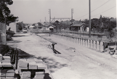 Black and white photo of alterations being made to 