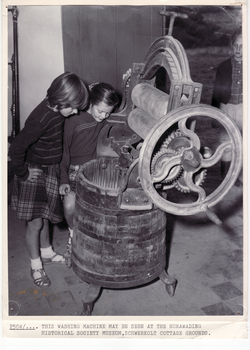 Schwerkolt  Cottage showing children looking at a washer/wringer.