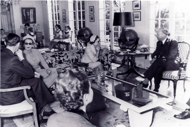 Black and white photo of drawing room in home of Mr. Roger de Stoop during visit of Prince and Princess of Luxembourg