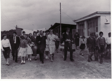 Official party inspecting living quarters of weaving mills.  Mr. Roger de Stoop with Princess of Luxembourg