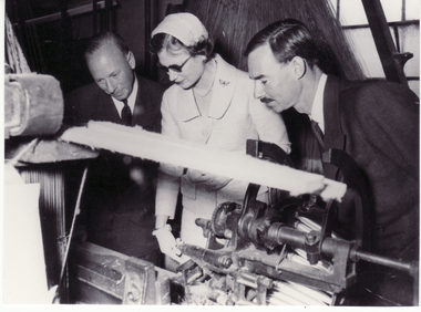 Black and white photo of Mr. Roger de Stoop and Prince and Princess of Luxembourg inspecting machinery