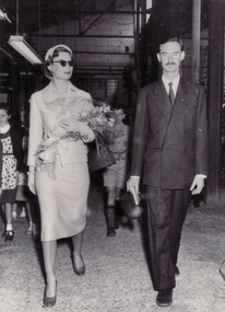 Black and white photo of Prince and Princess of Luxembourg in factory