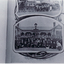 black and white photo of Travellers' Rest Hotel, Whitehorse Road, Blackburn.  Appears to have been photographed from a book.  Large group of men outside hotel.