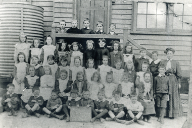 Black and white photo of Grades 1 and 2 of Vermont State School with teacher Miss Julia Flynn