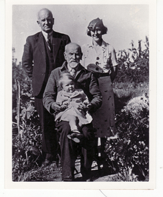 Black and white photo of Charles Toogood (standing) Richard Toogood (seated) Vera Luscombe nee Toogood (standing) and June Luscombe