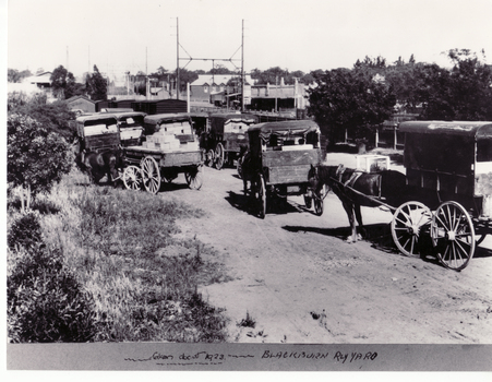 Black and white photo of  traders horse drawn carts in Blackburn Railway Yards in 1923.