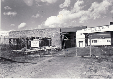 Black and white photo of entrance to Blue Moon Fruit Co-Op