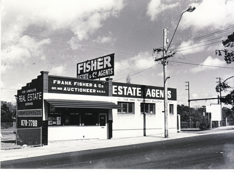 Black and white photo of Fisher Real Estate offices
