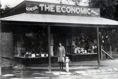 Black & white photo of shop ' THE ECONOMIC' GENERAL DRAPERS. Cnr. of South Parade & Blackburn Road. c1918 