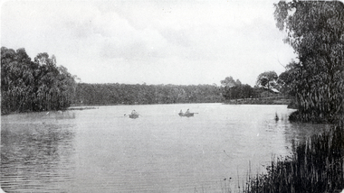 Black & white photo of Blackburn Lake showing boats for hire. 