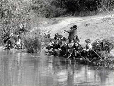Physical description  Black and white photo of children from Blackburn Lake Primary School fishing for yabbies in the Blackburn Lake Sanctuary in 1974.