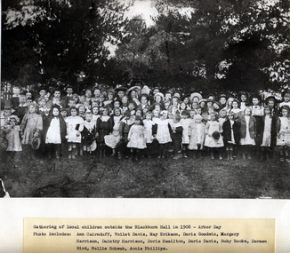 Black and white photo of local Blackburn School children outside Blackburn Hall on Arbor Day 1908.