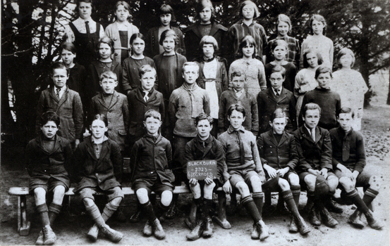 Black and white photo of Grades 6,7, and 8 of Blackburn State School in 1924. 