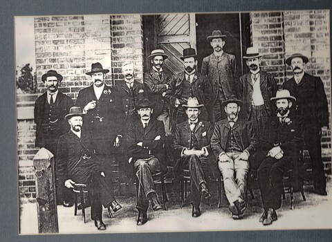 Black and white photo of Apex Club members.