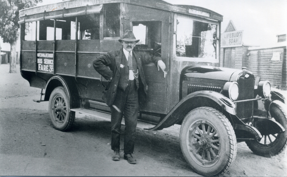 Black and white photo of Vermont Bus 1925, driver Mr. Tom Brockell.