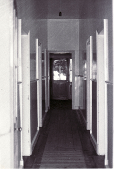 Black and white photo of  the interior of Station Master's House Mitcham.