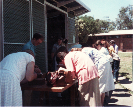 Coloured photo of Mitcham State Primary School Centenary Celebrations. Signing Commemorative Bricks. 1988.