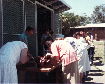 Coloured photo of Mitcham State Primary School Centenary Celebrations. Signing Commemorative Bricks. 1988.