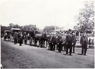 Black and white photo of John McGlone's Funeral on 3 September 1892.. Horse drawn hearse with pallbearers 