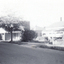 Black and white photo of Cottage Street, Blackburn, showing  mixture of buildings as Factories replace Houses.