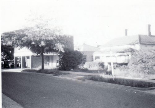 Black and white photo of Cottage Street, Blackburn, showing  mixture of buildings as Factories replace Houses.