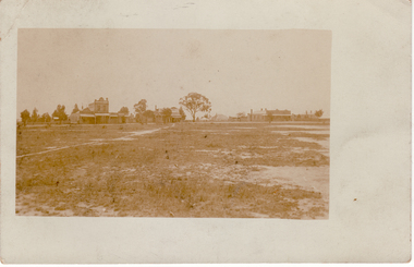 Black and white postcard of Mitcham Shopping Centre, North Side 1910 - 1920. - Cross Roads - Whitehorse and Mitcham Roads| - Prominent building is W.Morris grocer