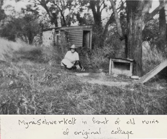 Photograph, Schwerkolt's Cottage (1st Cottage built 1864 ) partly demolished.   Myra Schwerkolt  seated, 1953