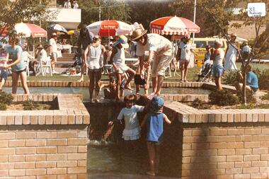 Coloured photo of Children playing at Nunawading Civic Centre.