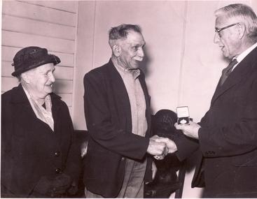 Photograph, Presentation of a silver medal by Mr. Don Walker to Mr. Harry Alderton