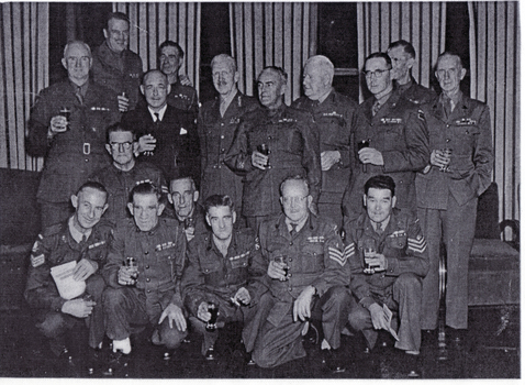 Frank Fisher, Army Warrant Officer left standing among Army Officers.